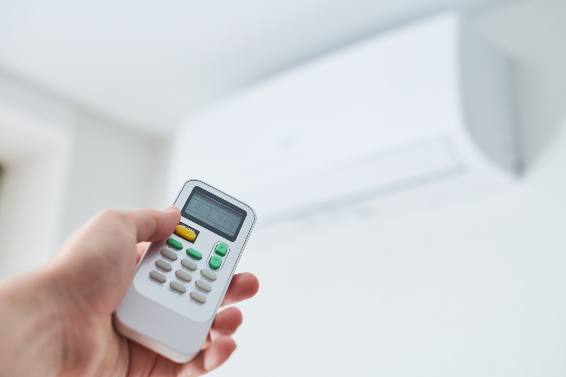 remote-control-for-air-conditioner-in-hand-2023-11-27-04-57-32-utc